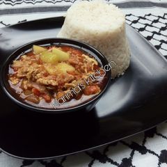 A picture of White rice/egg stew.