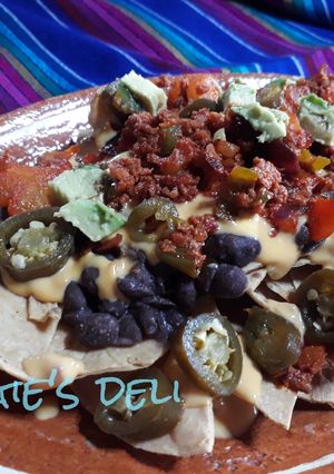 A picture of Nachos with Chorizo and Jalapeños.
