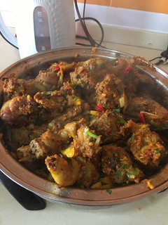 A picture of Chicken sauce with toasted coconut flakes.