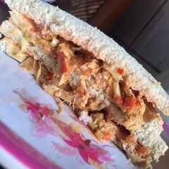 A picture of Chicken and veggies sandwich.