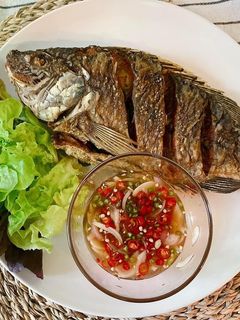 A picture of 🧑🏽🍳🧑🏻🍳How To Fry The Perfect Crispy Fish Serve with Thai Chili Fish Sauce |ThaiChef Food.