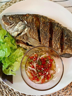 A picture of 🧑🏽🍳🧑🏻🍳How To Fry The Perfect Crispy Fish Serve with Thai Chili Fish Sauce |ThaiChef Food.