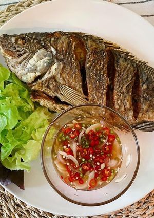 A picture of 🧑🏽‍🍳🧑🏻‍🍳How To Fry The Perfect Crispy Fish Serve with Thai Chili Fish Sauce |ThaiChef Food.