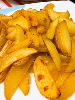 Una foto de Patatas gajos con especias!