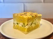 Una foto de zapallito relleno con polenta