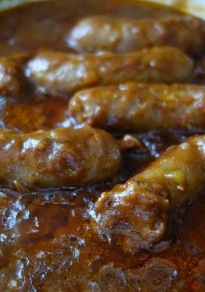 A picture of Sausages with Tomato gravy.