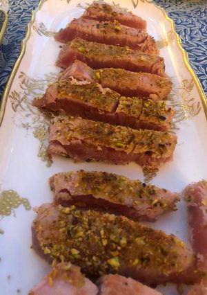 A picture of Tuna steak with pistachio crust.