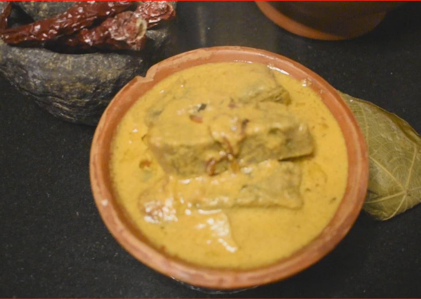Pathrade Colocasia Rolls in coconut gravy with Mutton Chicken