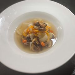 A picture of Simple mushroom and vegetable consommé.