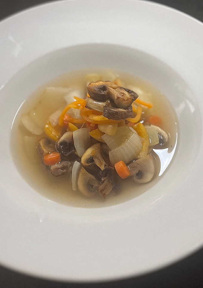 A picture of Simple mushroom and vegetable consommé.