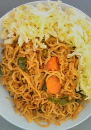 A picture of Coconut flavored noodles with cabbage.