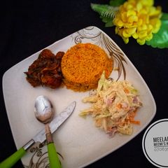 A picture of Fried rice with pepper chicken and coselow.