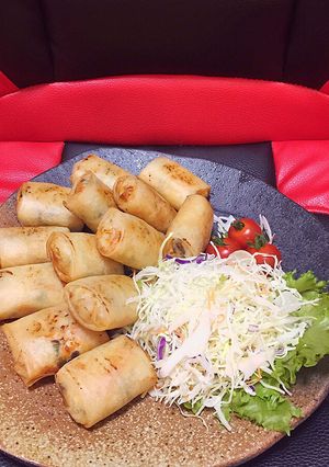 A picture of Chicken and King Oyster Mushroom Spring Rolls with Vegetables.