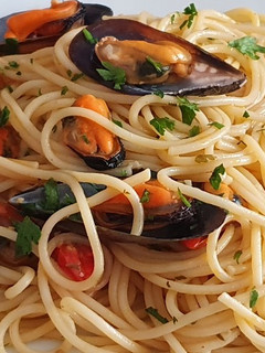 Una foto de Spaghetti con le cozze e pomodorini