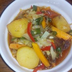 A picture of Irish potatoes with veggies.
