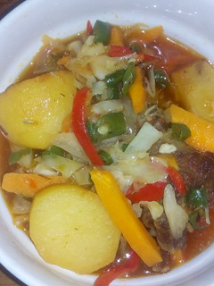 A picture of Irish potatoes with veggies.