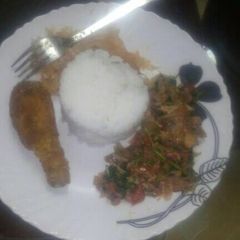 A picture of Braised rice acco by chicken stakes,ratatoulle,cabbage.