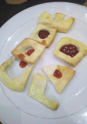 A picture of Fried yam wit ketchup.