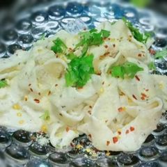 A picture of Alfredo fettuccine pasta.