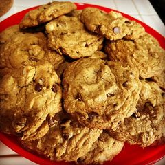 A picture of Copycat Mrs. Field's Chocolate Chip Macadamia Nut Cookies.
