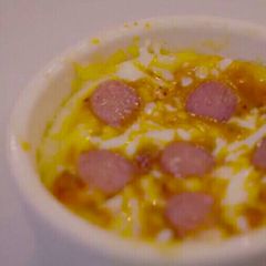 A picture of Pizza in a mug.