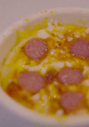 A picture of Pizza in a mug.