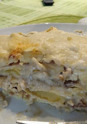 A picture of Lasagna with Eggplant Pesto, Caciocavallo Cheese, and Speck.