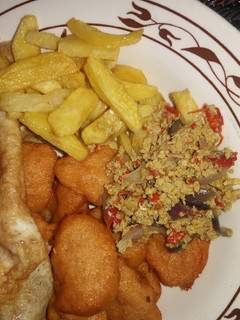 A picture of Egg source, chips, akara n fried egg.