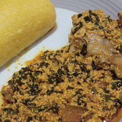 Egusi soup and eba A picture of Egusi soup and eba.