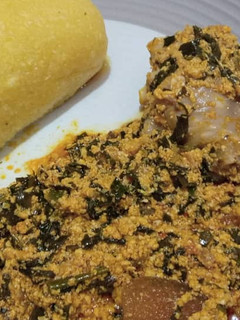 A picture of Egusi soup and eba.