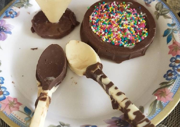 White Chocolate cup and spoon and milk chocolate filled with sprinkle