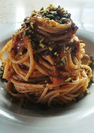 A picture of Spaghetti with Sun-Dried Tomato Pesto and Chopped Pistachios.