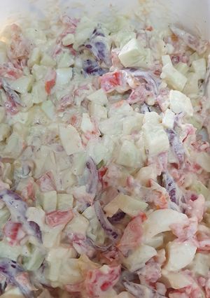 A picture of Tomato cucumber salad.