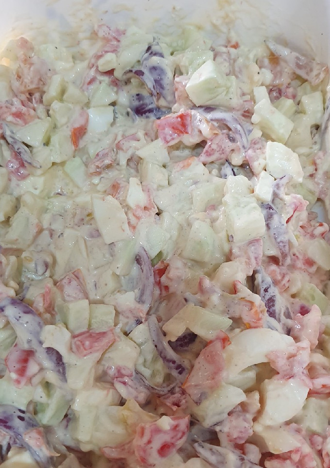 A picture of Tomato cucumber salad.