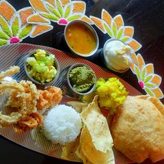 A picture of Poori Shrikhand Thali.