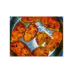 A picture of Bhat karelar pur or Teasel gourd stuffed.