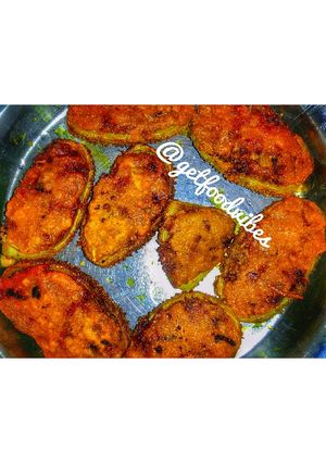 A picture of Bhat karelar pur or Teasel gourd stuffed.