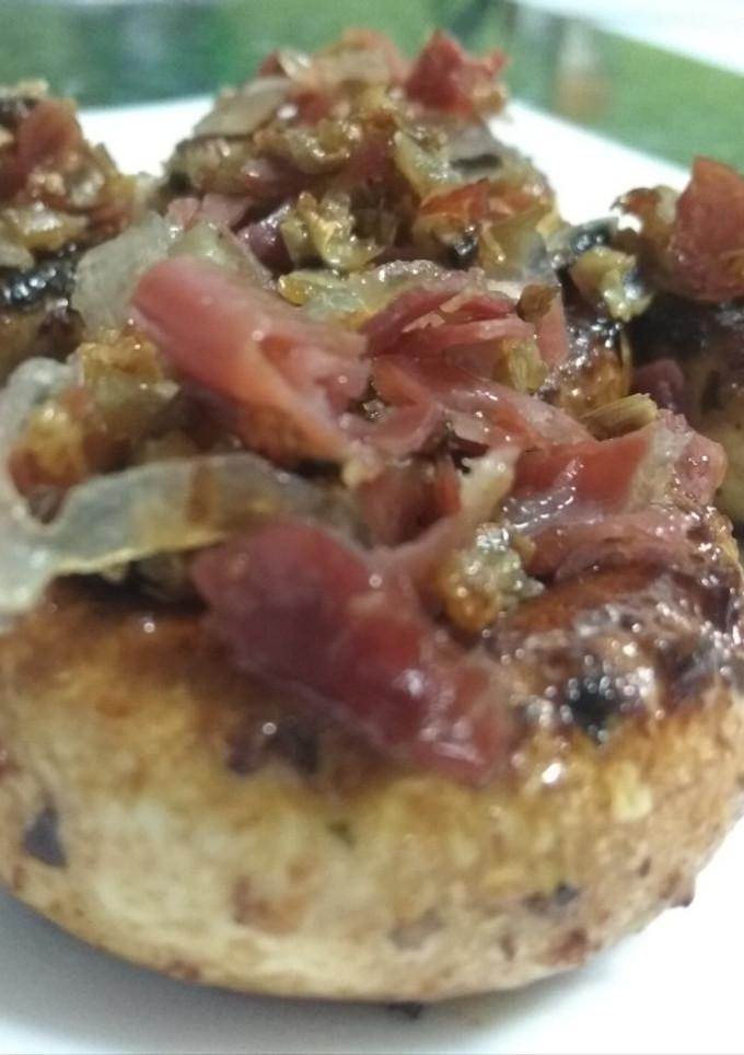Una foto de Champiñones a la plancha con jamón