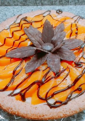 Una foto de Tarta de crema pastelera y duraznos