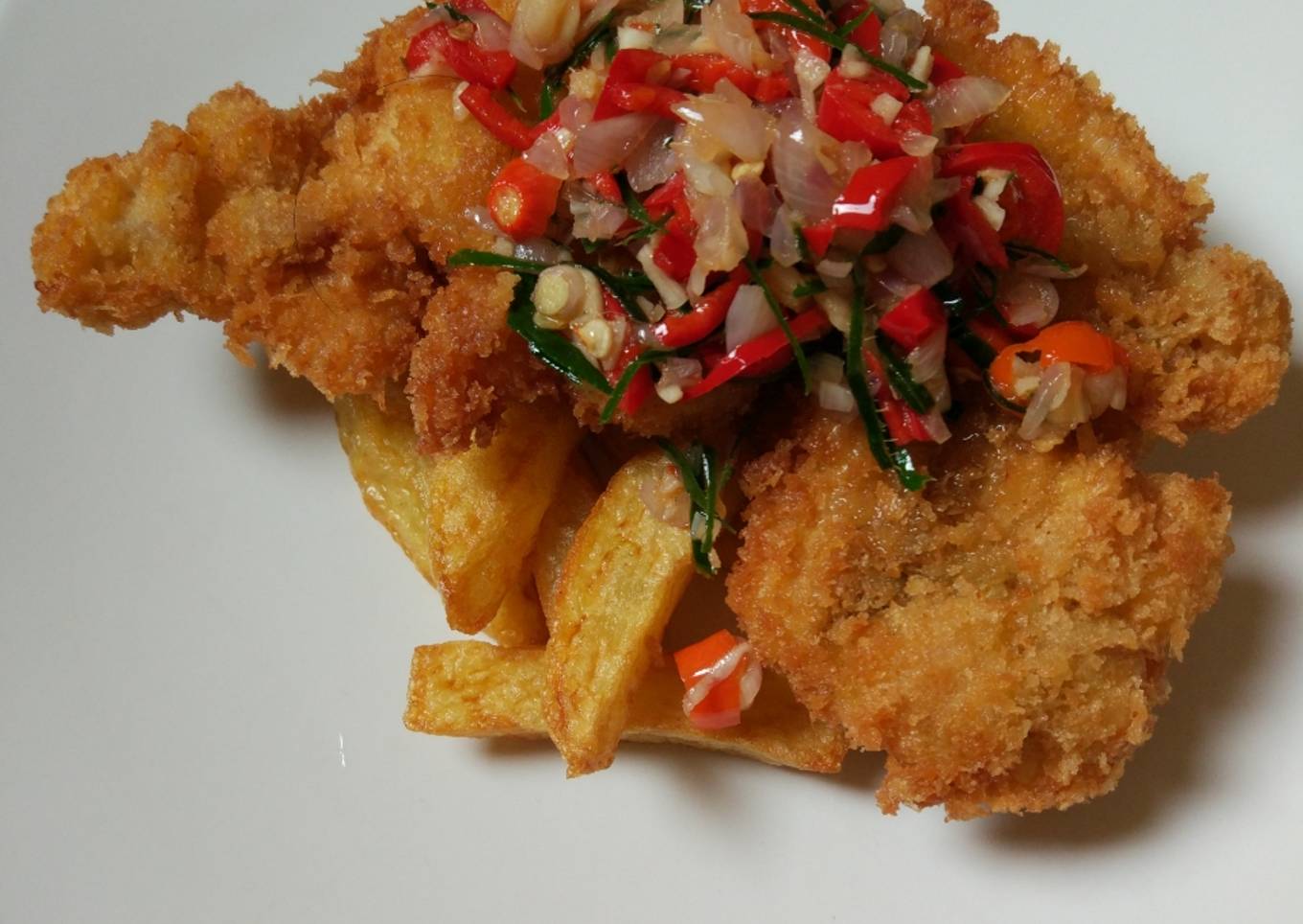 Chicken schnitzel serve with French fries & sambel matah