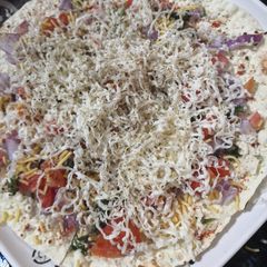 A picture of Cheese masala papad.