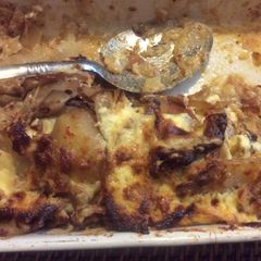 A picture of Spicy oven baked sautéd potato and bacon gratin.
