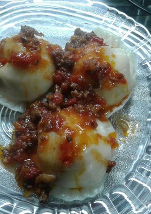 Una foto de Sorrentinos con tapa de empanadas