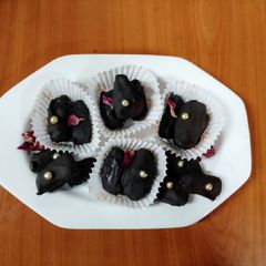 A picture of Dates,almonds chocolate 🍫.
