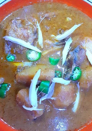 A picture of Aloo chicken qorma curry.