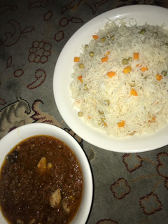 A picture of Vegetable white rice and fish stew.