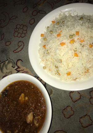 A picture of Vegetable white rice and fish stew.