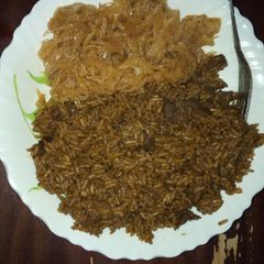 A picture of Pilau and steamed cabbage.