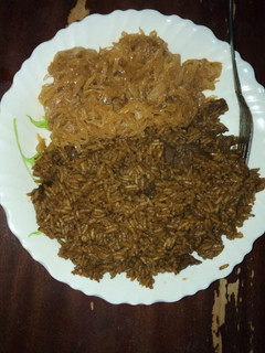 A picture of Pilau and steamed cabbage.