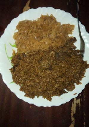 A picture of Pilau and steamed cabbage.